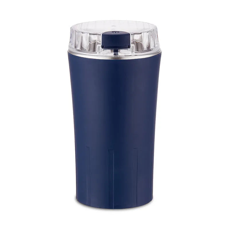 Blue mini flour mill and grinder machine for food on a kitchen worktop.