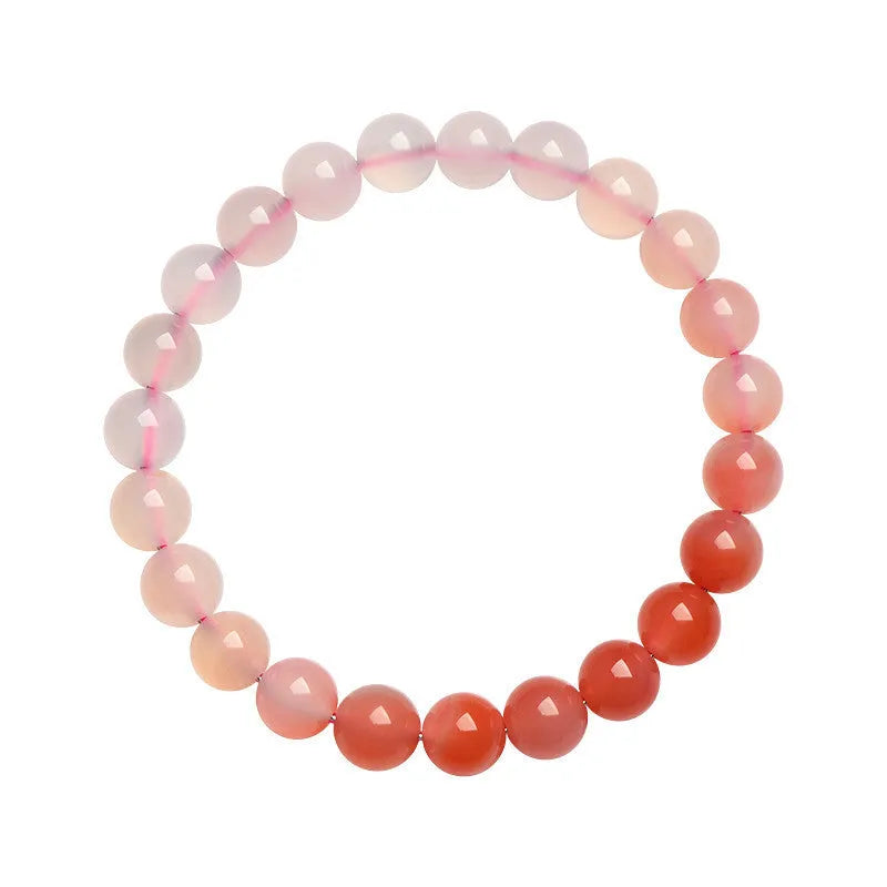 Natural gradient Yanyuan agate bracelet with geometric polished beads on a wrist, showing salt source colour variation.