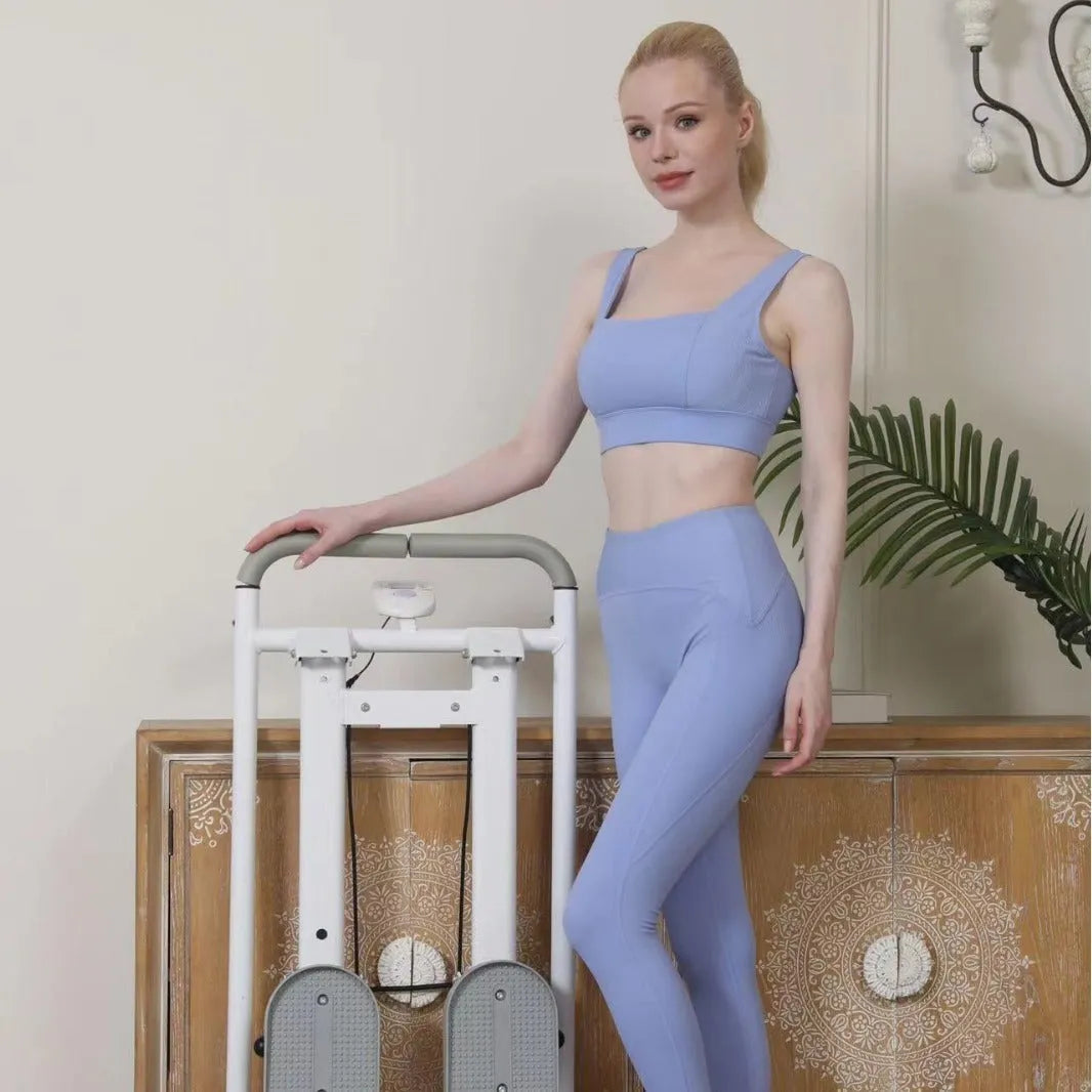 White foldable treadmill integrated with a climbing frame for home fitness exercise.