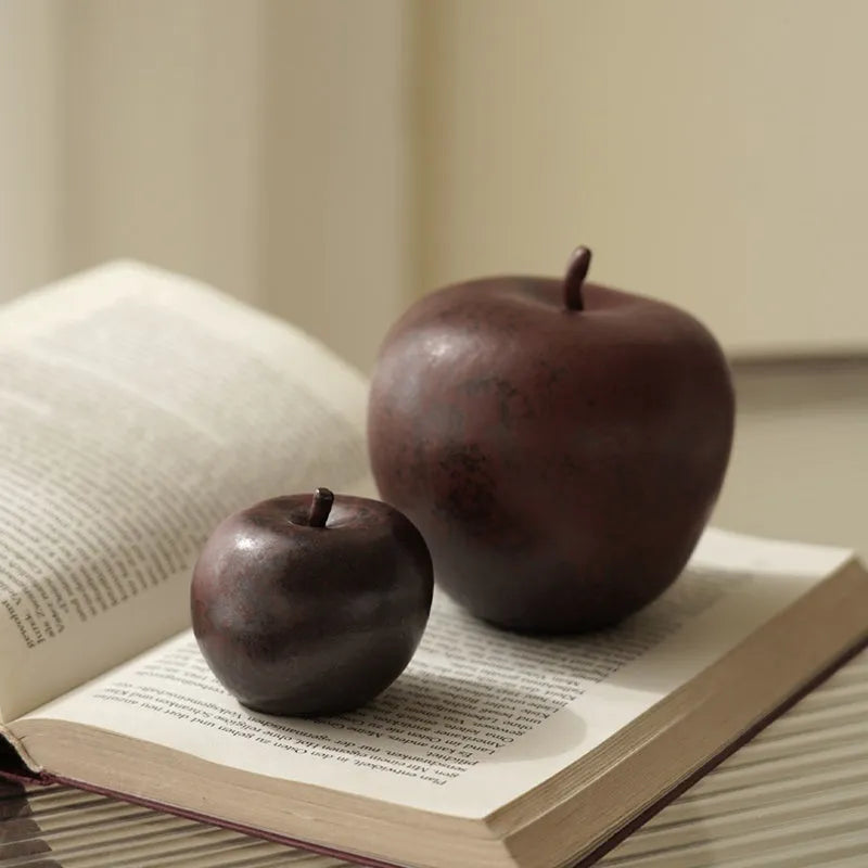 Retro style Chinese ceramic apple decoration ornament on a desktop.