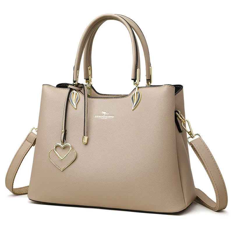 Women's black PU leather messenger bag with multi-layer interior compartments and a shoulder strap