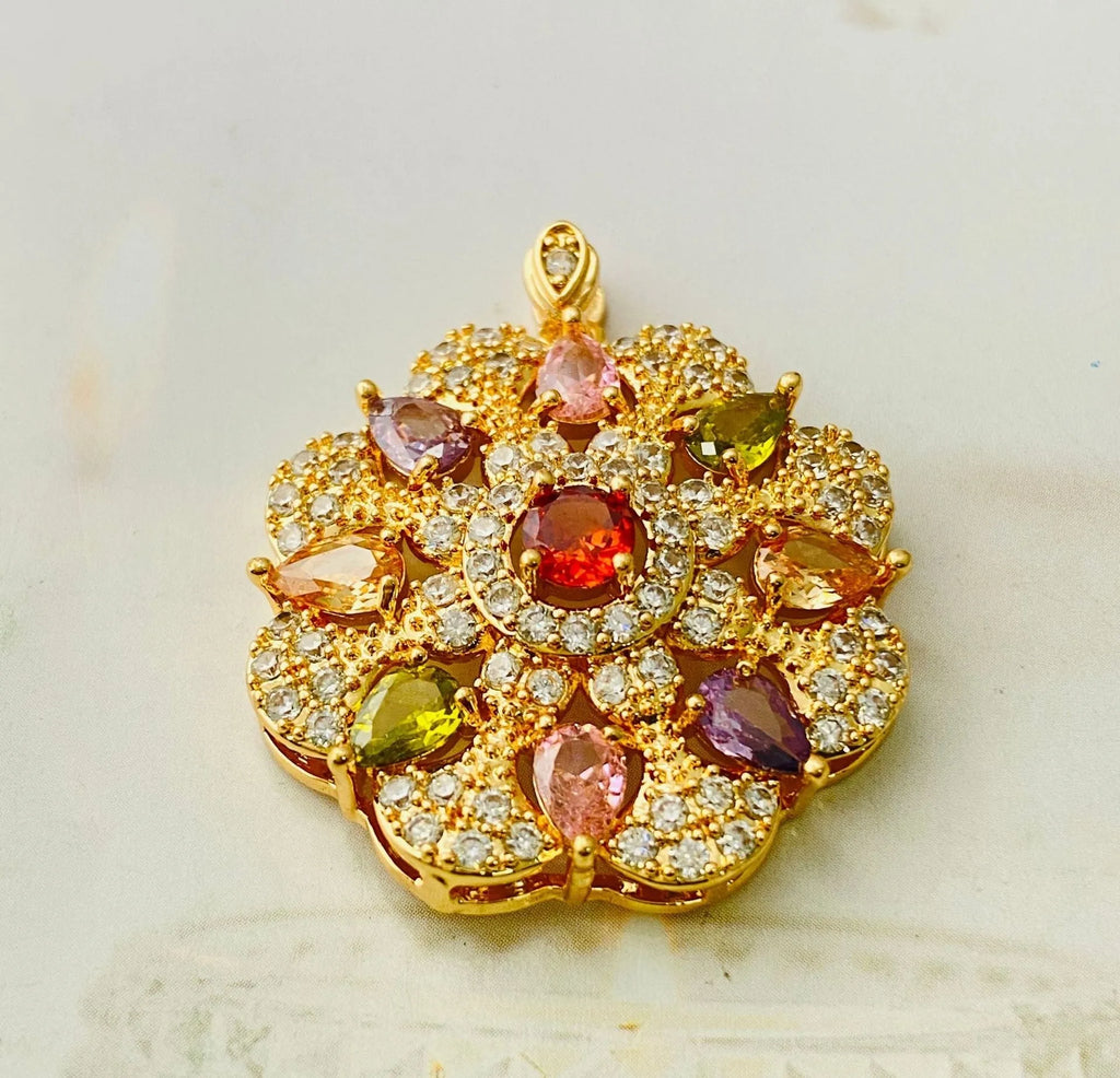 Close-up of a women's colourful zircon flower pendant necklace with a gold electroplated finish on a model.