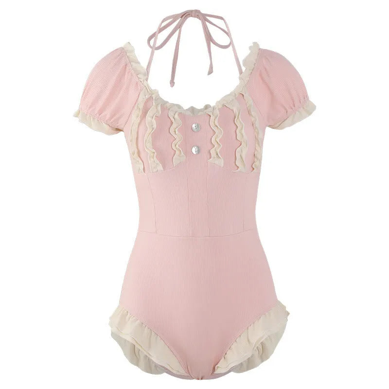 Pink women's conservative one-piece swimsuit with cute Siamese design on mannequin