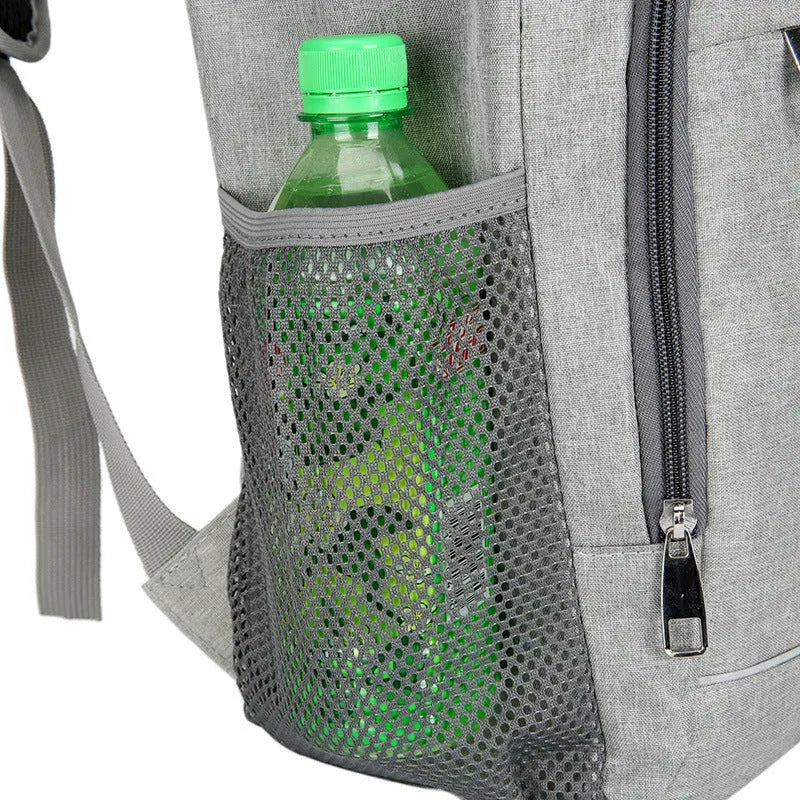 Large black outdoor thermal picnic backpack with curved shoulder straps on a gray background.