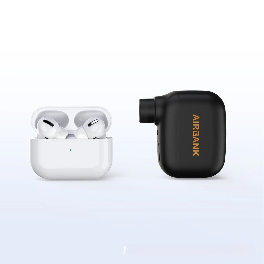 Black AS100 mini electric bike pump with USB charging cable and waterproof bag.