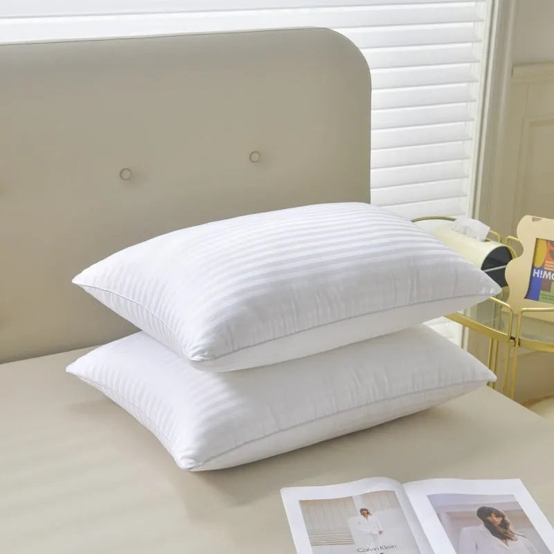 White cotton satin stripe pillow with feather cotton filler, shown in low, medium, and high loft options.