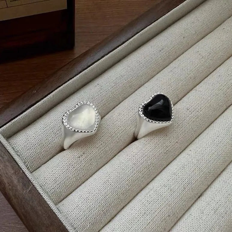 S925 sterling silver ring with black agate heart on adjustable open band.