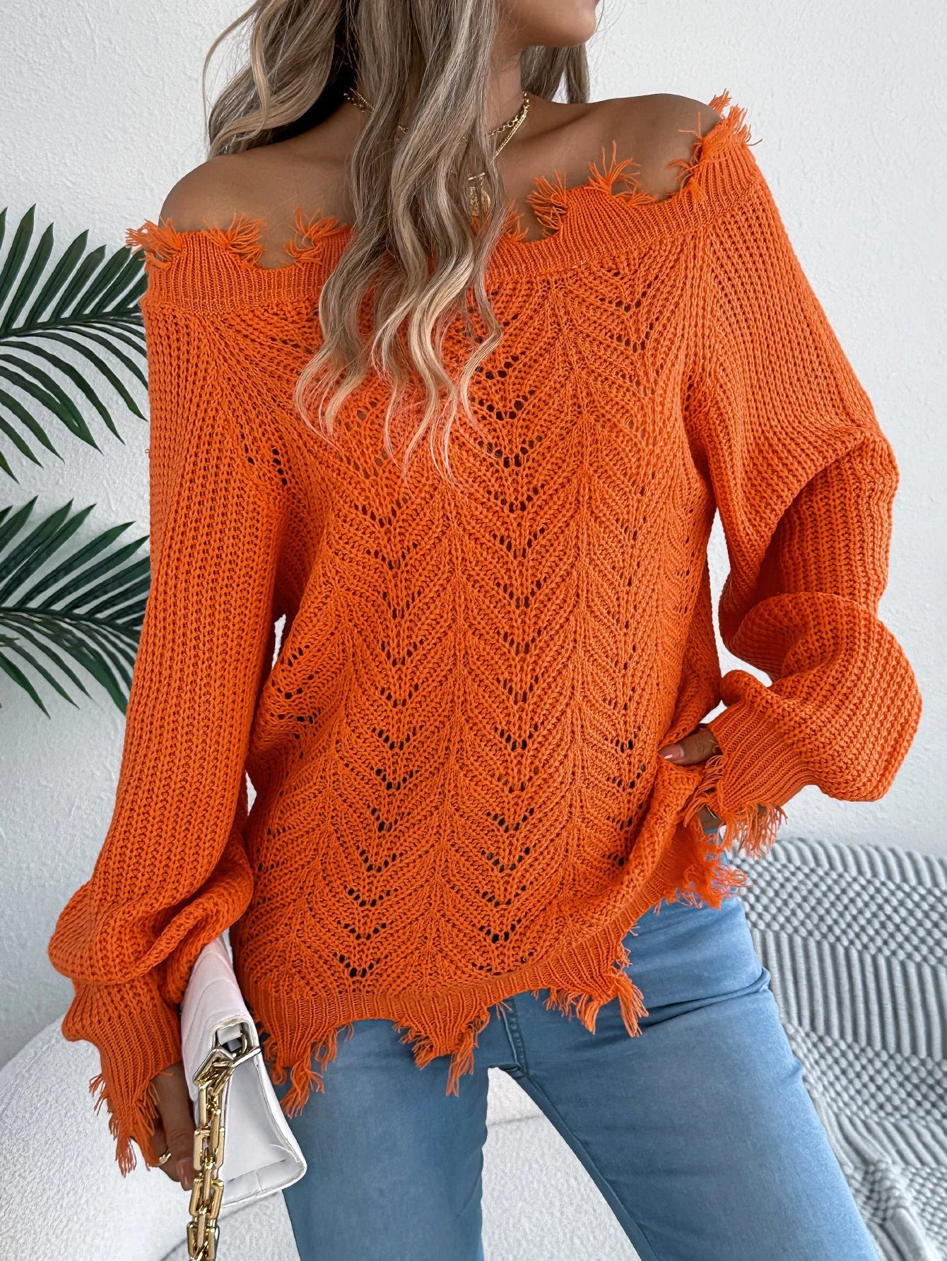 Hollow-out cut-off shoulder pullover sweater in artificial wool acrylic fabric showing street fashion styling