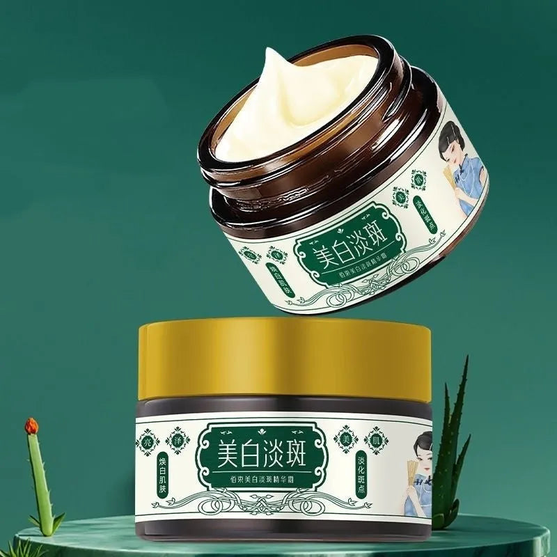 Baishu skin whitening and spots lightening essence cream in a 30g bottle with white and gold label
