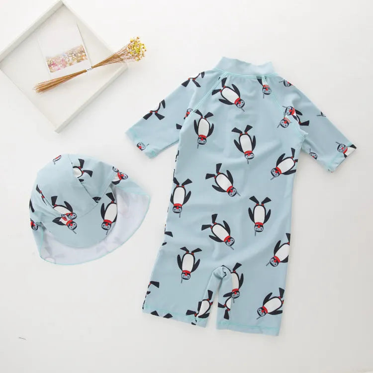 Boys' penguin print one-piece swimsuit with long sleeves and matching swimming cap for children aged 2-7 years