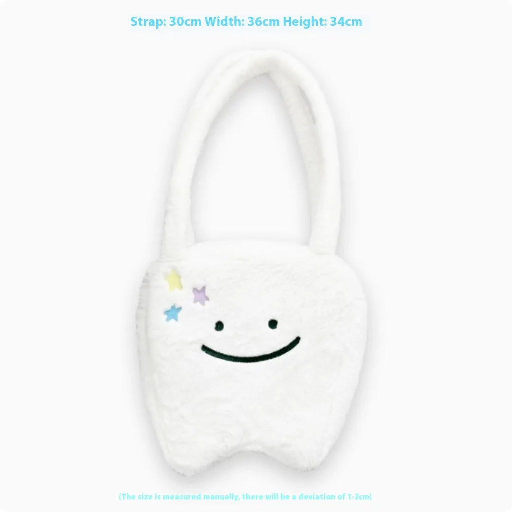 White plush tote bag with cute teeth pattern, showing crossbody strap and zipper closure.