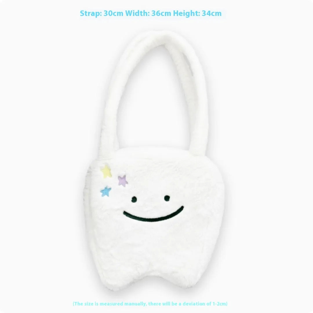 White plush tote bag with cute teeth pattern, showing crossbody strap and zipper closure.