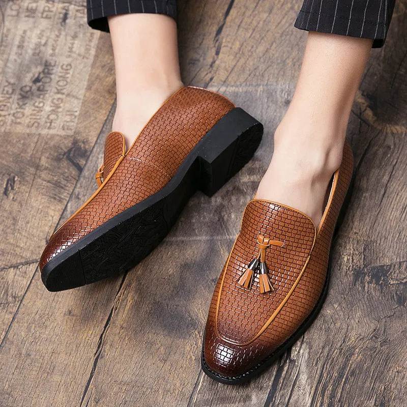 Men's black slip-on business shoes with pointed toe and tassel detail