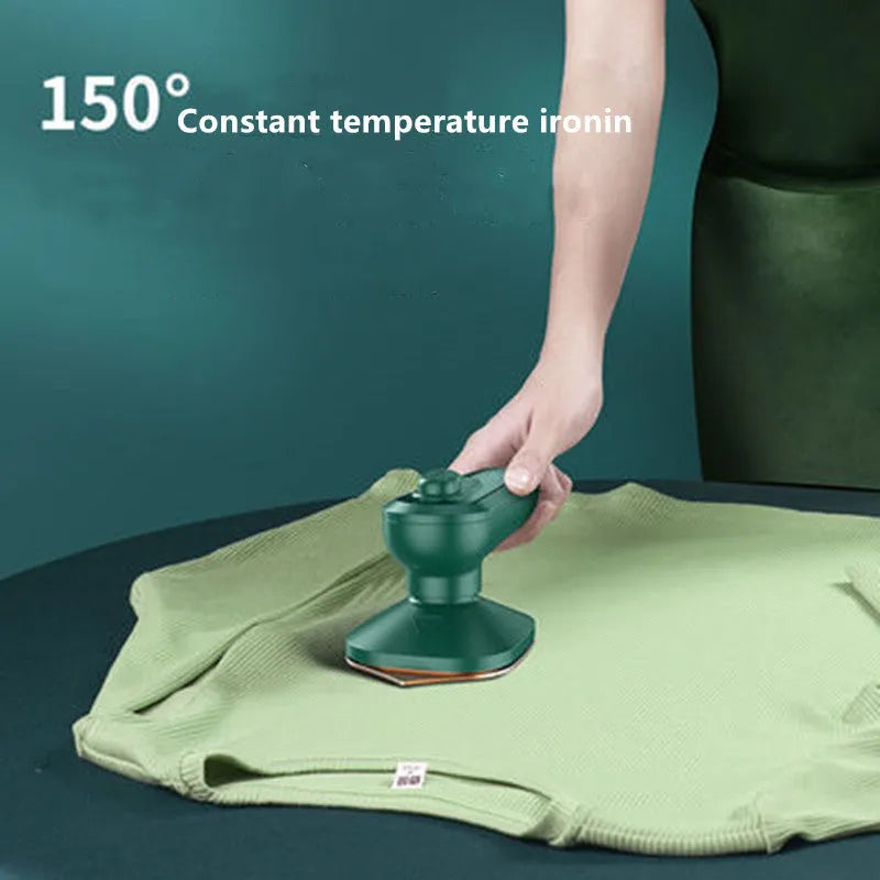 Dark green portable hanging steam iron with ceramic panel, compact design for travel garment care