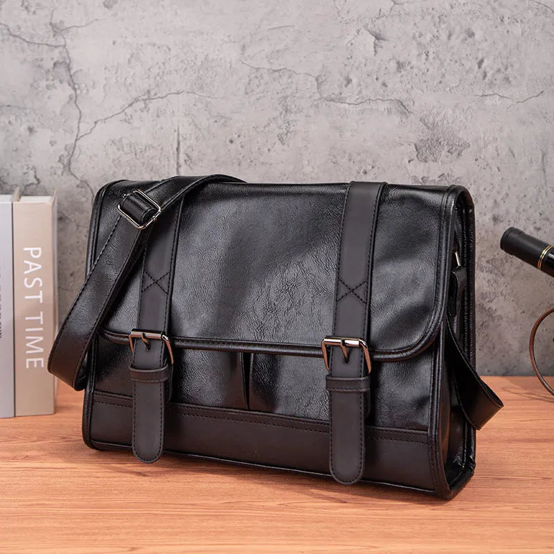 Black Korean-style anti-theft commuter backpack made from PU leather with contrast stitching