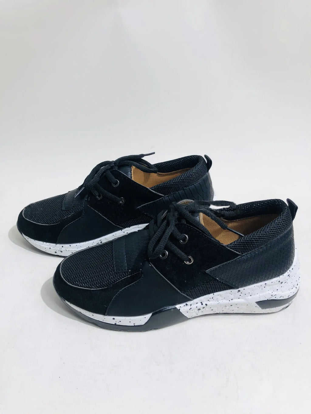 Women's suede flat sneakers with a wedge heel in leopard print, shown from the side.