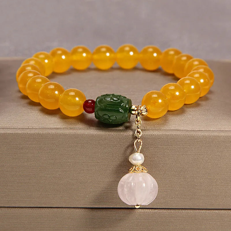 Women's yellow agate and crystal adjustable wrap bracelet on gold silk thread in khaki.