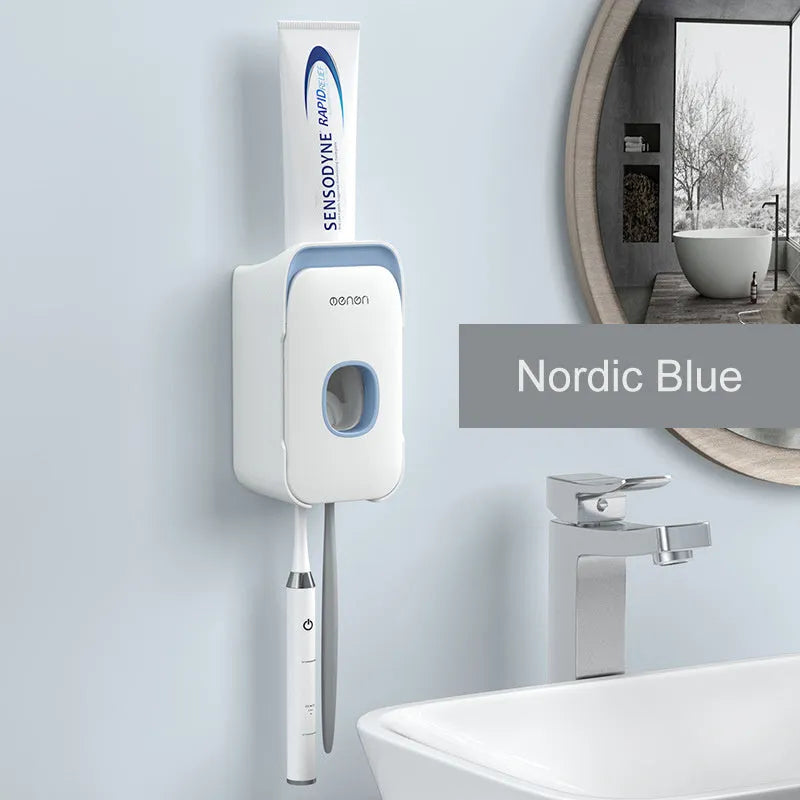 Automatic wall-mounted toothpaste dispenser in blue colour on a bathroom wall.