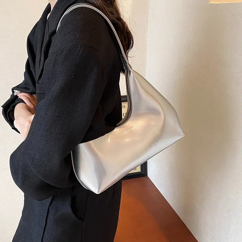 French style PU leather shoulder bag with sewing line detail and dumpling shape, available in multiple colours