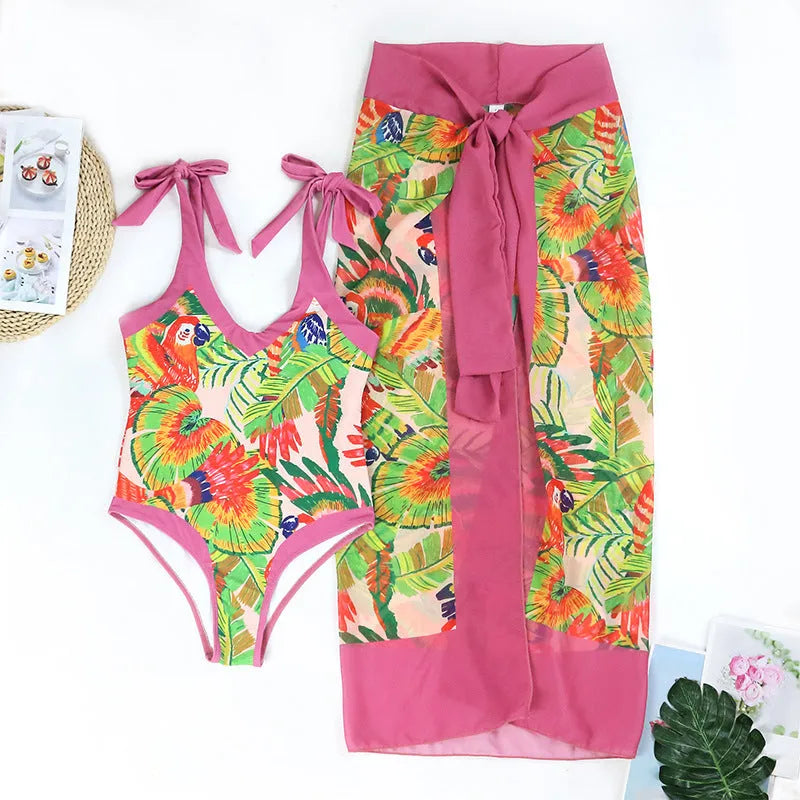 Women's pink floral print retro one-piece swimsuit with V-neck, covered belly and thin skirt