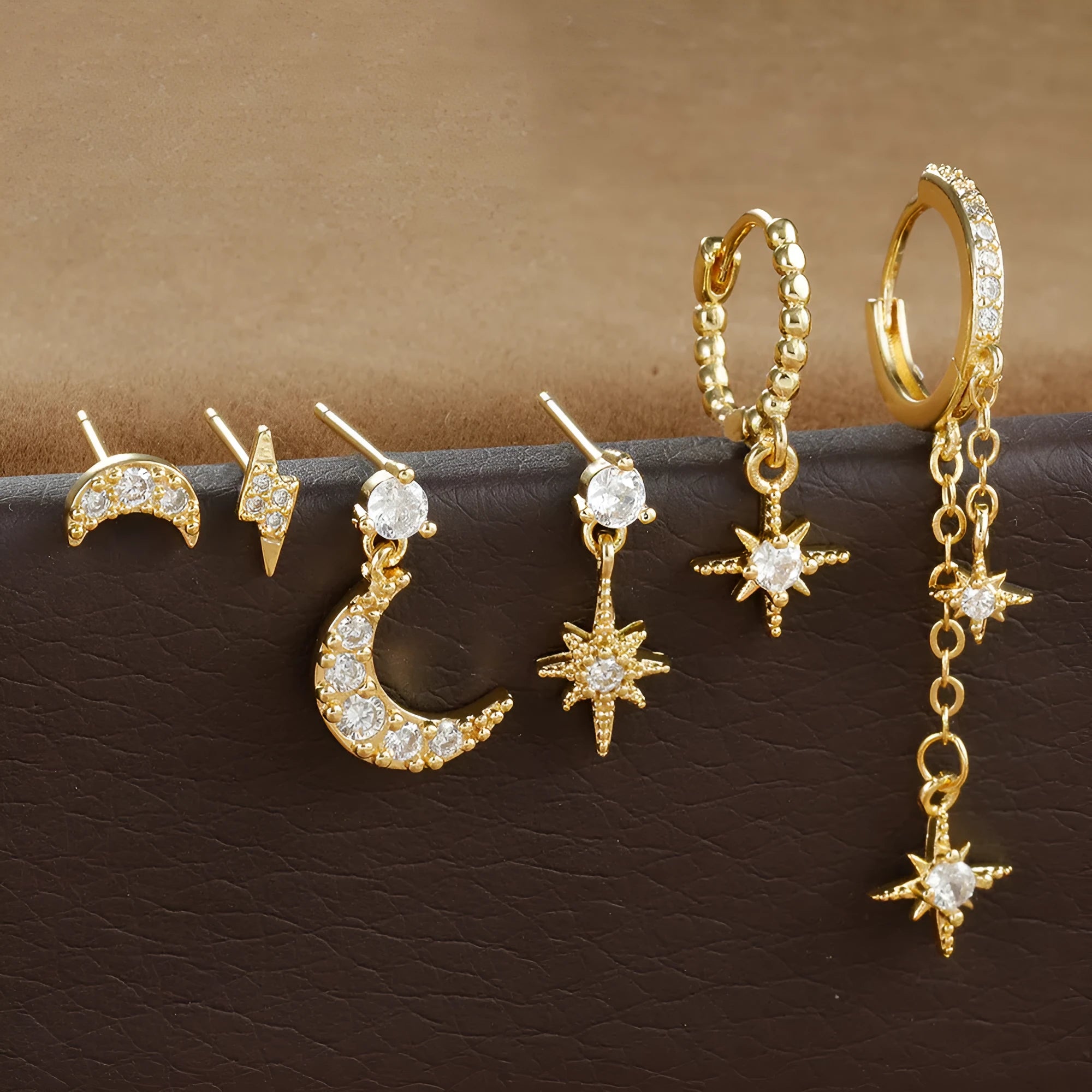 Gold colour XINGX chain tassel earrings set with six pieces showing zircon stud details