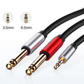 3.5mm stereo to two 6.5mm male audio cable with gold-plated connectors on a black background