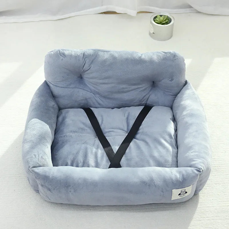 Car-mounted pet outing nest in grey and blue plaid options showing stain-resistant cloth construction
