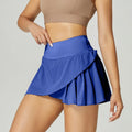 Women's solid colour quick-dry sports shorts in nylon with spandex lining for fitness.