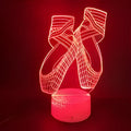 3D laser-etched ballet shoe night light with coloured LEDs on an ABS base, showing remote control.