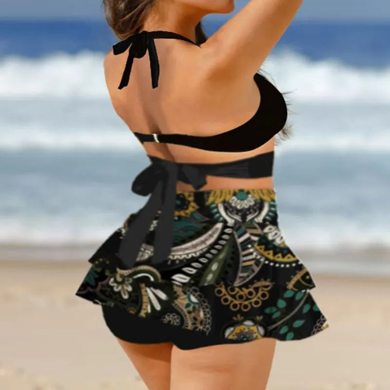 Purple women's bikini with lace-up detail and matching high-waisted split skirt