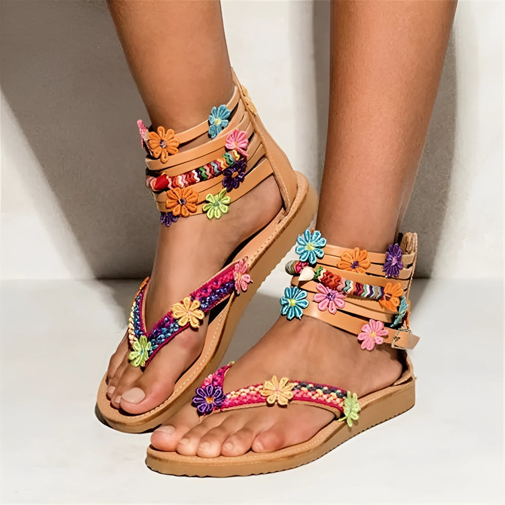 Women's beaded petal flower decoration on ethnic Roman-style flat sandals with artificial PU upper.