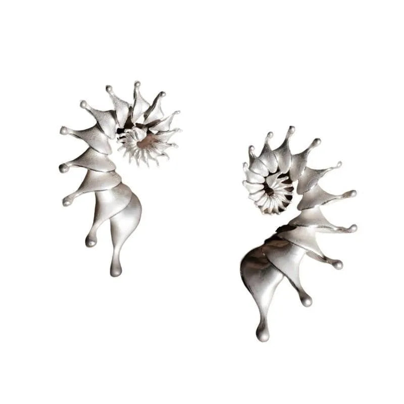 Conch coloured stud earrings with three-dimensional irregular design and matte alloy finish