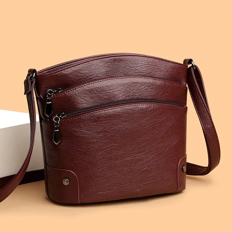Large capacity multi-layer bucket bag in available colours including black, brown, and green