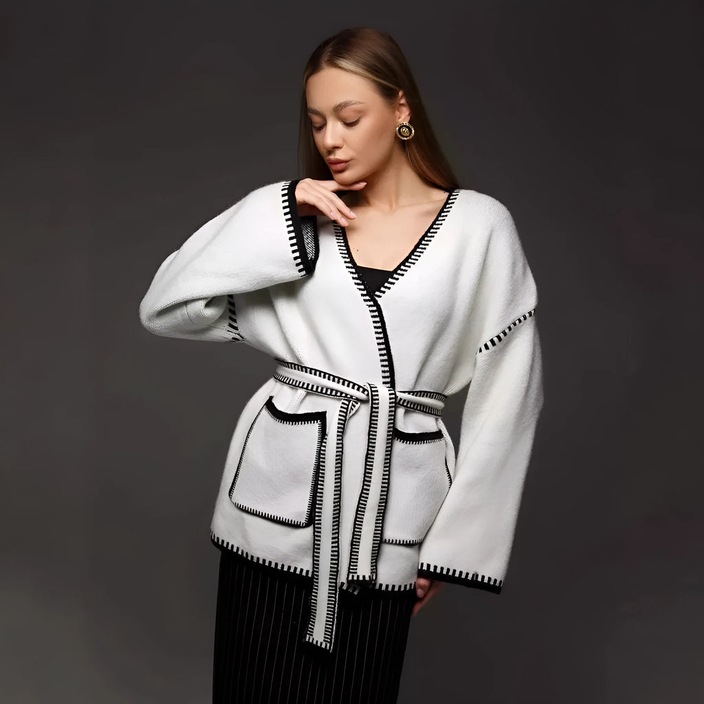 Loose lace-up front knitted cardigan in camel colour, showing mid-length fit and long sleeves.