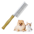 Wooden handle pet grooming comb for dogs and cats on a plain background