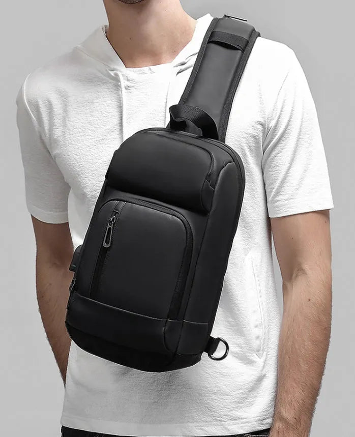 Black PVC outdoor leisure shoulder bag with air cushion strap and internal organisers