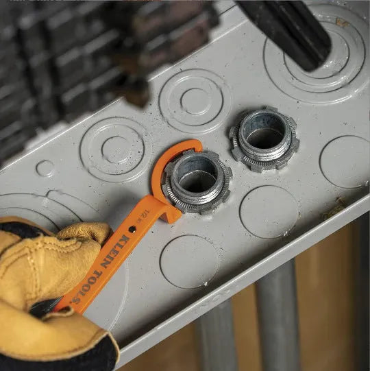 Orange, grey, and black magnetic crescent wrenches with catheter locking mechanism on one tool