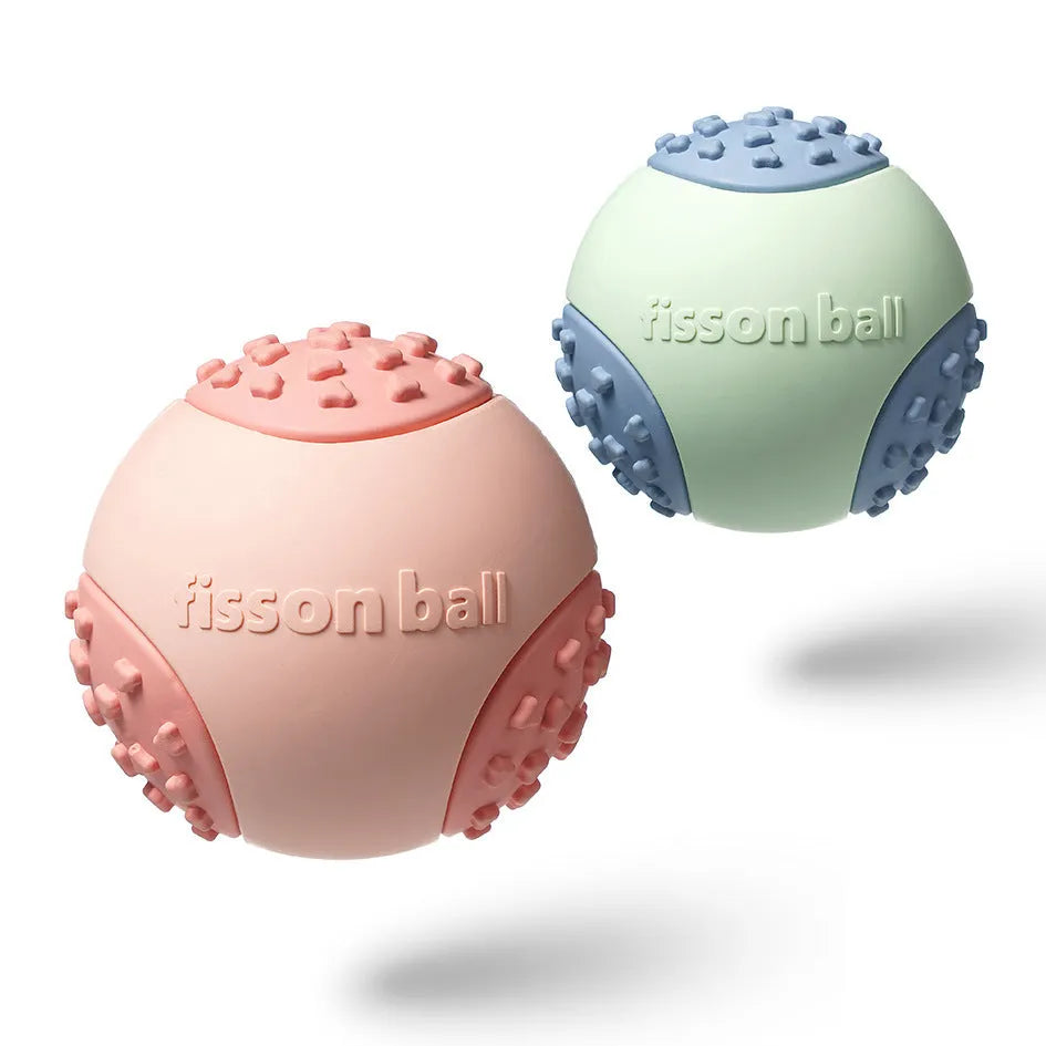 Green and pink 64mm durable rolling ball interactive dog toy.