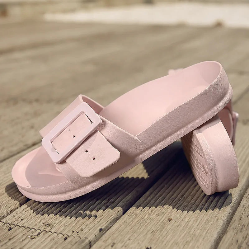 Women's grey blue flip-flop sandals with an adjustable buckle on the strap and a soft EVA sole.