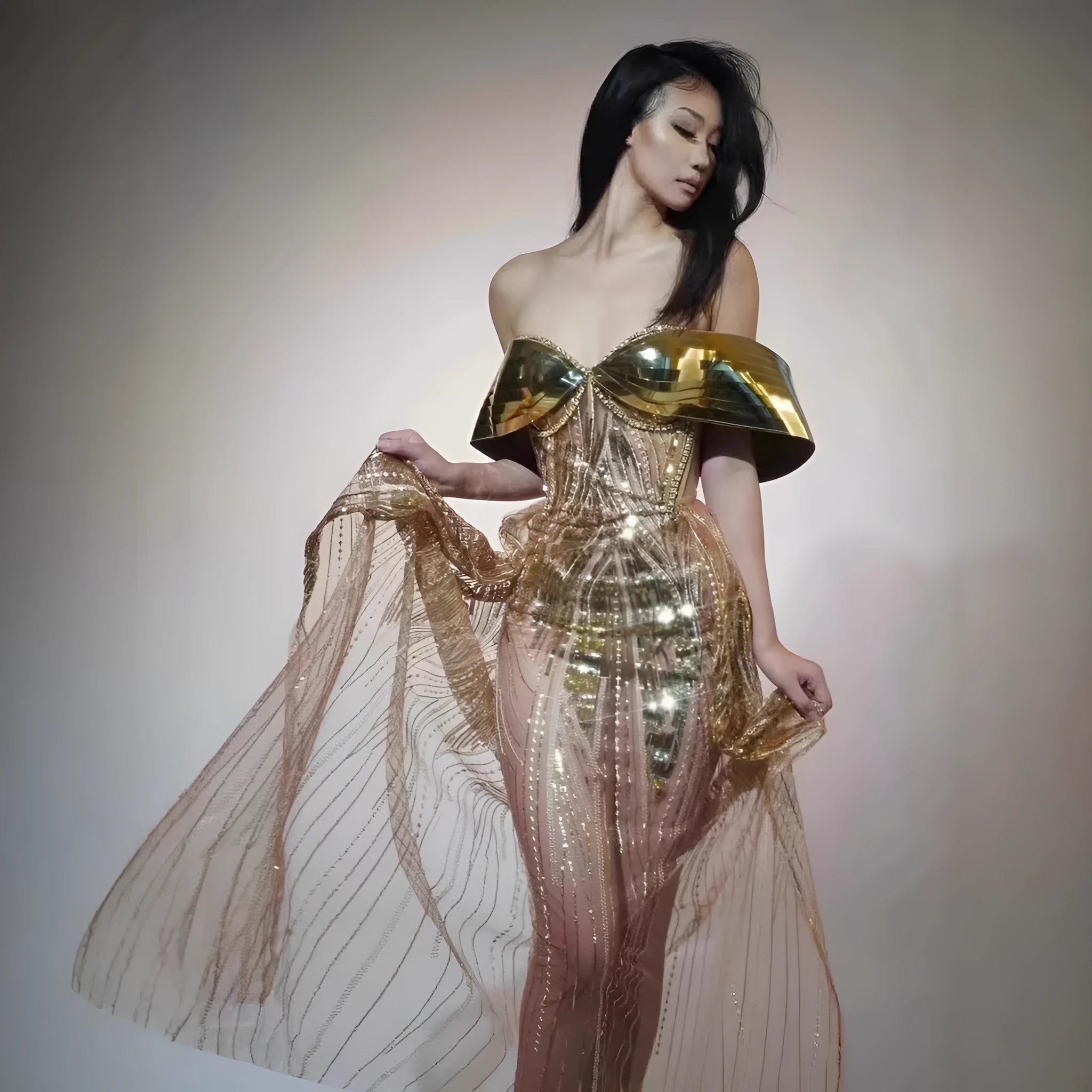 Gold strapless sequined dress with tulle skirt and high-leg split, sleeveless tube top design