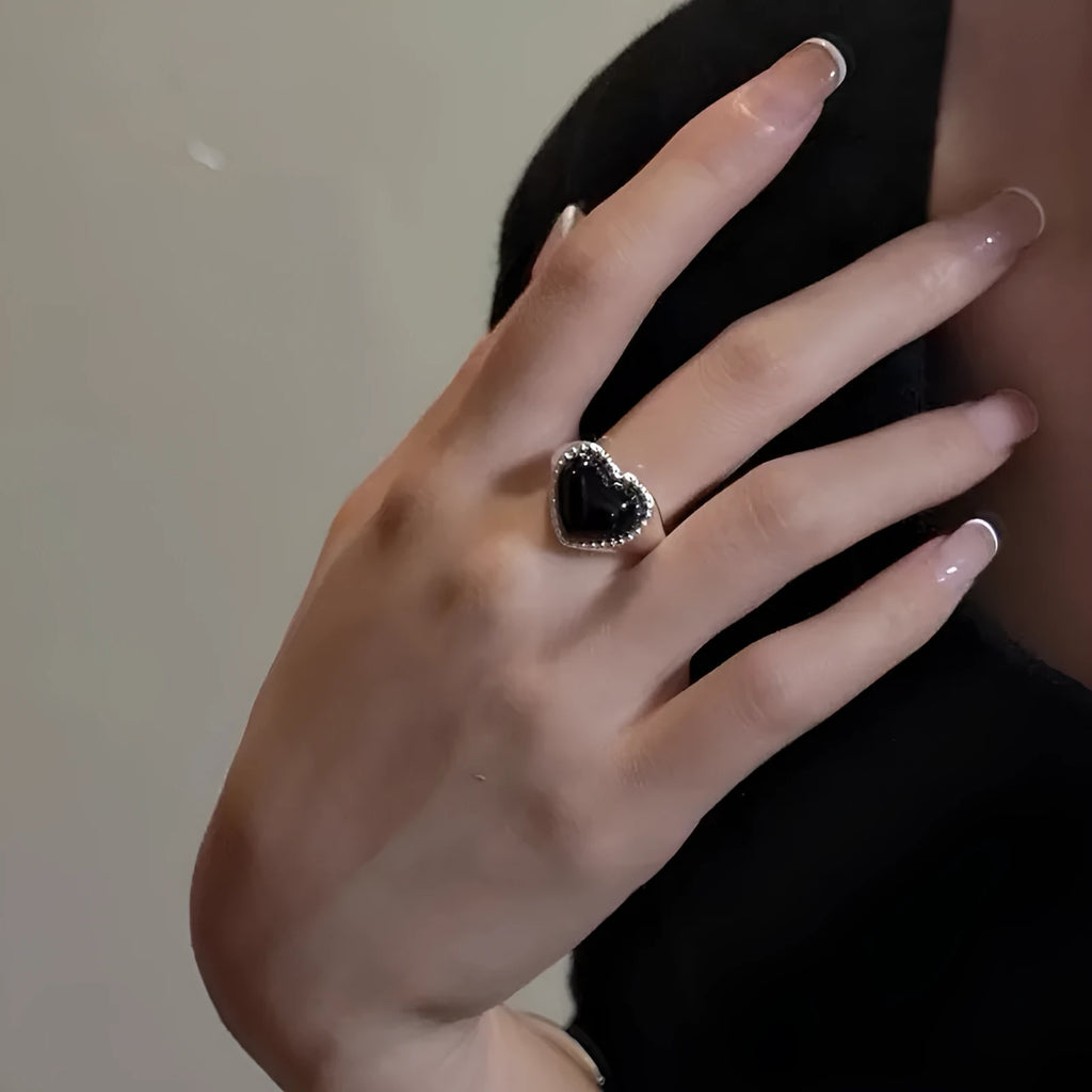 S925 sterling silver ring with black agate heart on adjustable open band.