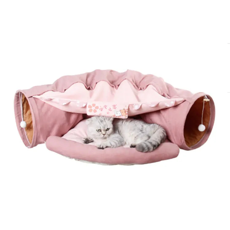 Dismantling and washing pet litter cat tunnel in green cloth with a cat inside