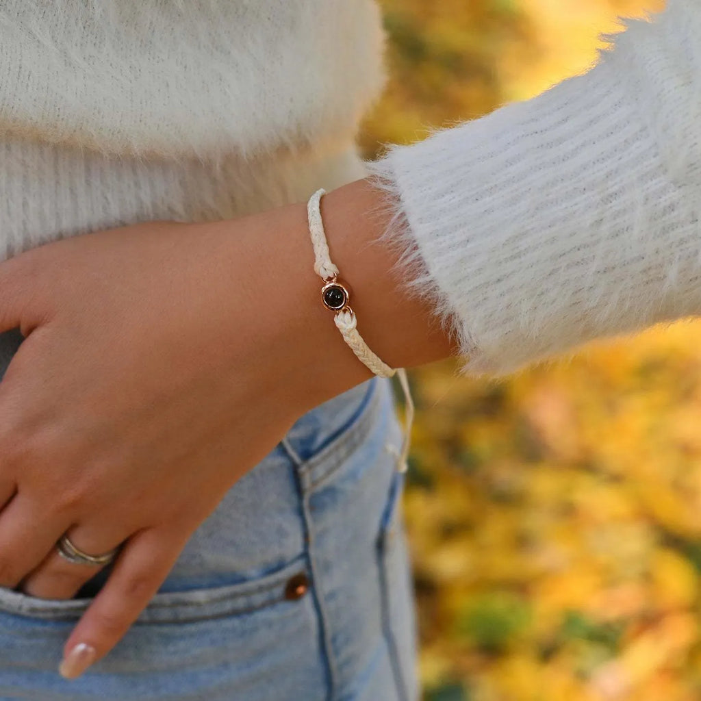 Handcrafted custom photo projection bracelet in silver with white rope, featuring alloy pendant with gold-plated inlaid artificial gemstones