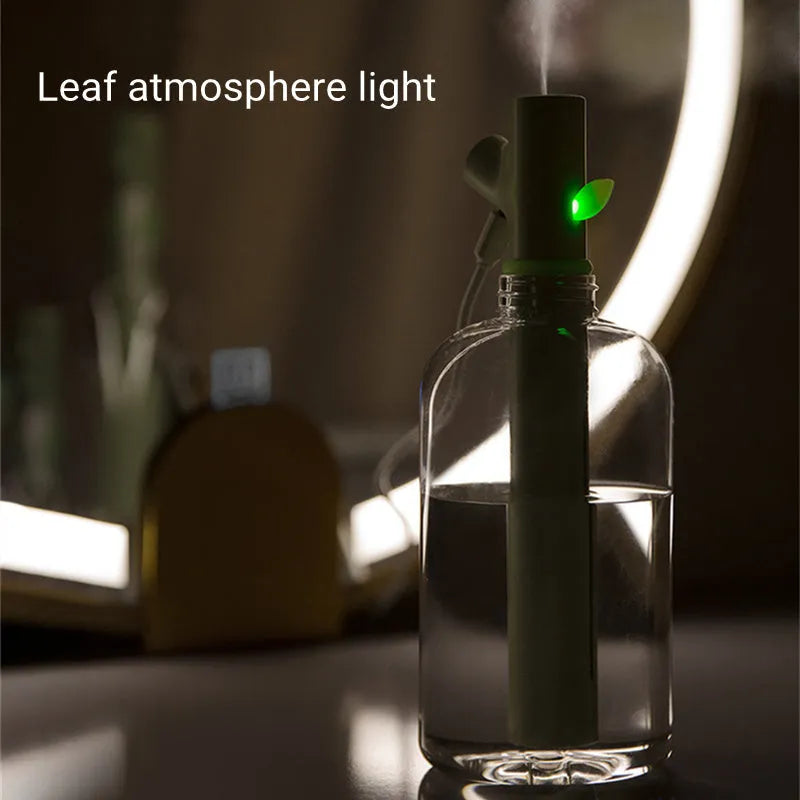 Transparent plastic USB portable humidifier with water tank showing mist output