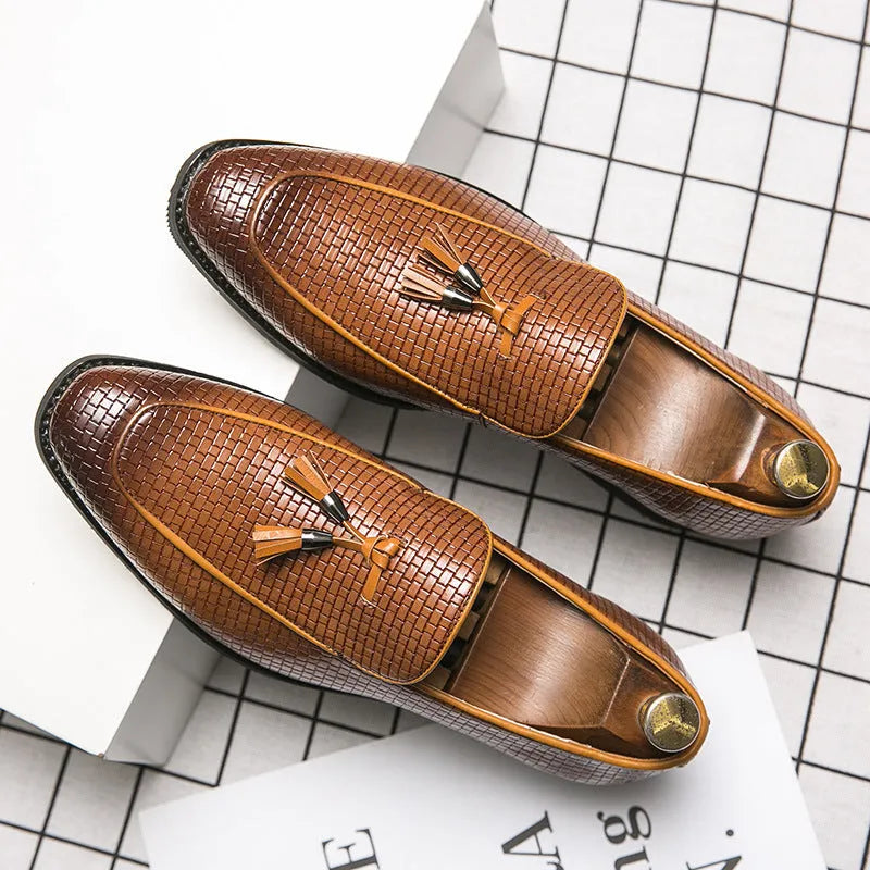 Men's black slip-on business shoes with pointed toe and tassel detail