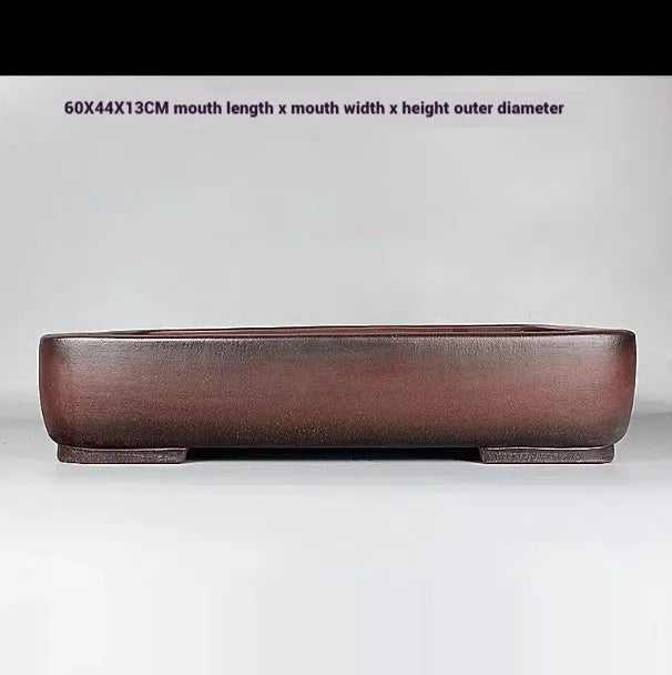 Handmade rectangular antique-style purple clay flower pot showing natural ceramic material