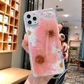 Slim TPU iPhone case with a large pink floral print on the back.