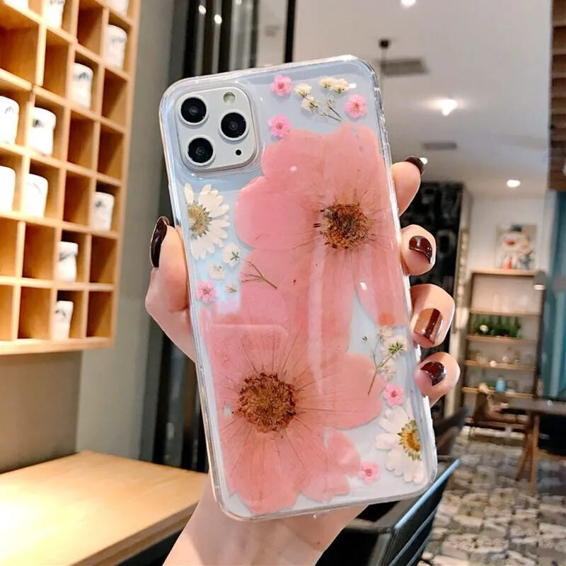 Slim TPU iPhone case with a large pink floral print on the back.