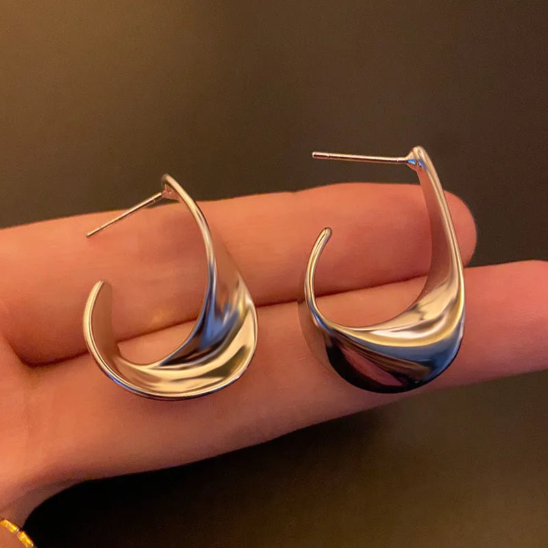 Twisted geometric metal earrings in gold and silver electroplated finishes