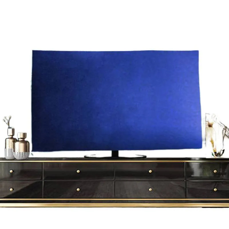 Soft pink velvet TV cover draped over a flat-screen television.